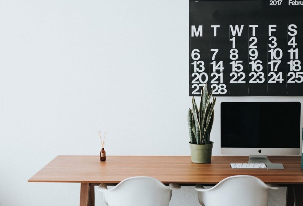 Home desk with wall calendar