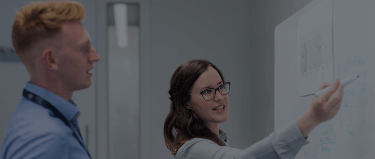 Consultancy team at whiteboard