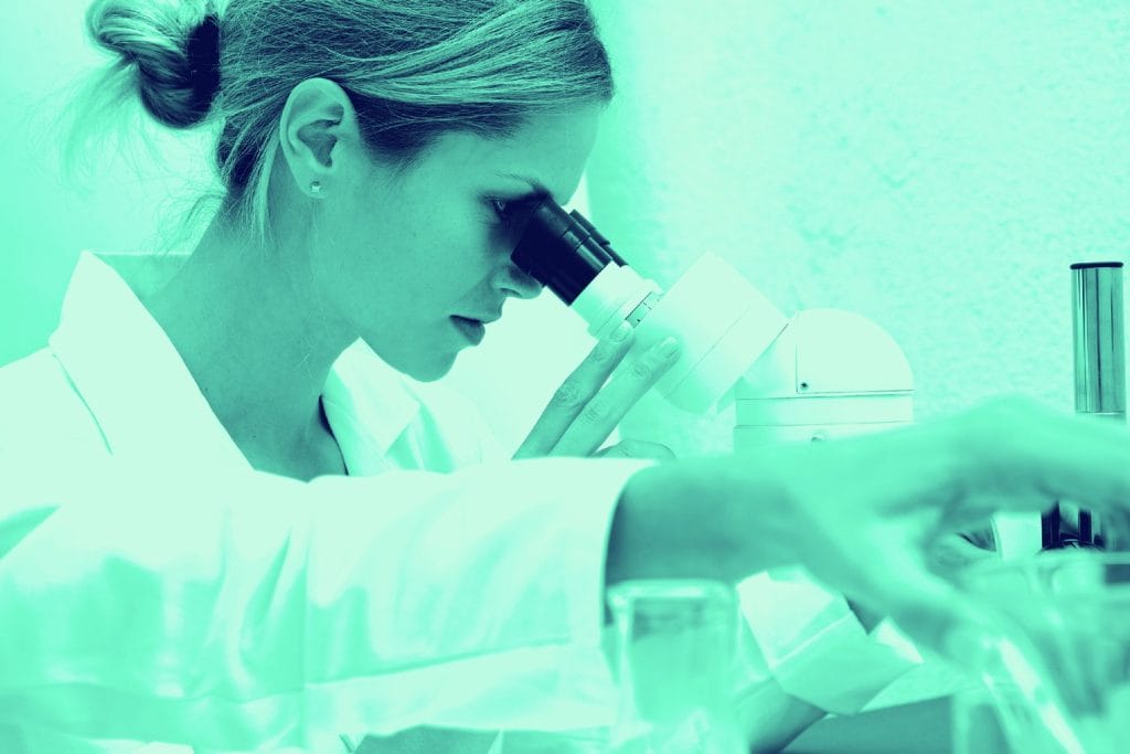 Scientist and microscope